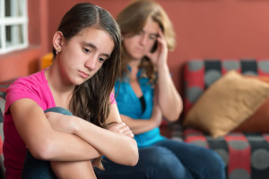 Teenager problems - Sad teenage girl and her worried mother